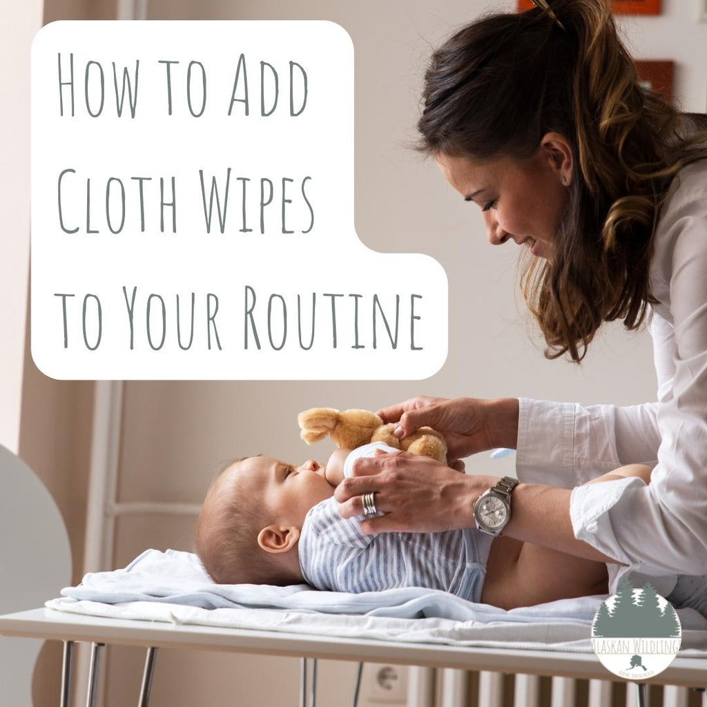 Woman changing her baby with the overlay "How to Add Cloth Wipes to Your Routine"